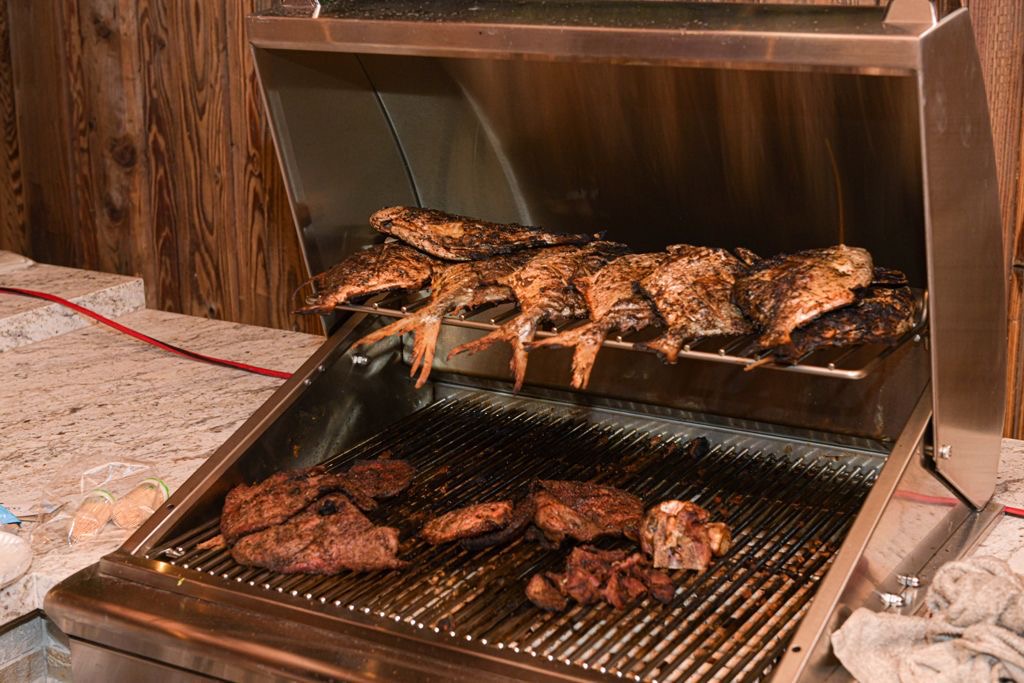 Catering grill loaded with fish and meat