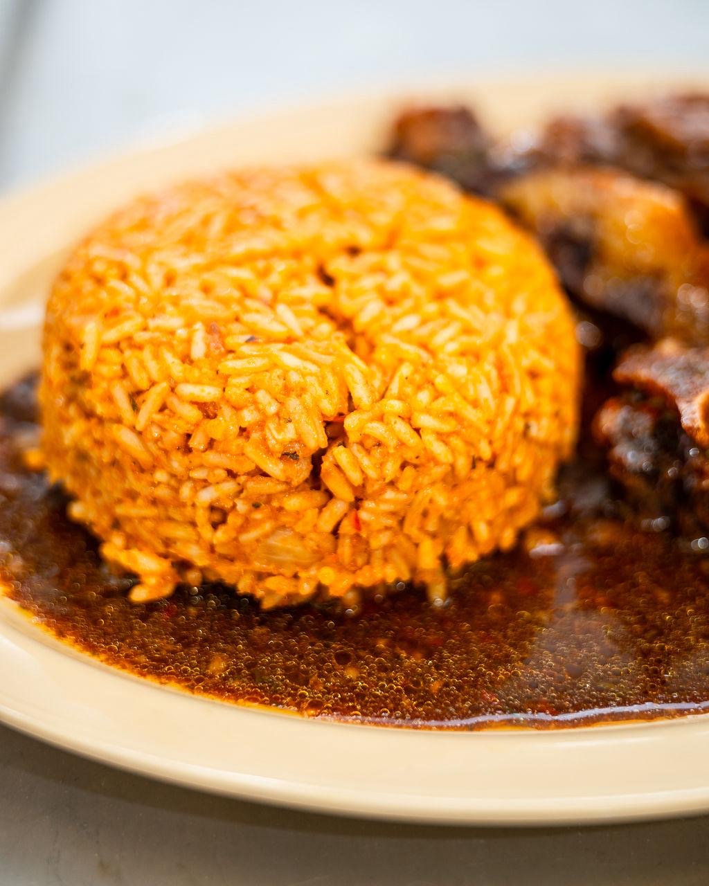 Close-up of native jollof rice with grilled meat